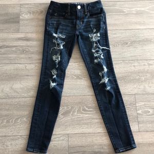 American Eagle skinny ripped dark blue jeans.